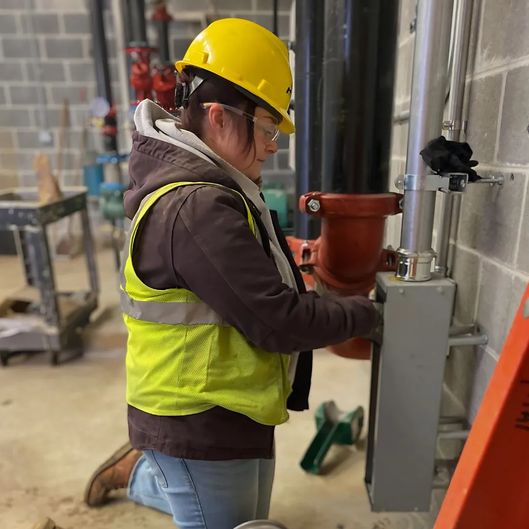 technician installing conduit